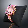 Elegant Pink Gemstone Bracelet With Golden Inlaid Design On Black Cushion