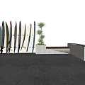 Vibrant Recreational Surfing Equipment with Colorful Patterns Flag Designs Arranged Against Wall with Plants
