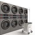 Stacked Commercial Washing Machines with Digital Control Panels and Laundry Cart