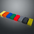Colorful Plastic Building Blocks In Various Colors Arranged On Gray Surface
