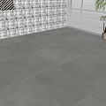 Modern Indoor Space With Gray Tile Floor White Wall Artwork And Potted Plant