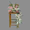 Bamboo Chair Adorned With Pink White Floral Arrangement And Green Foliage