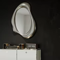 Irregular Shaped Silver Mirror Mounted On Black Wall Above White Cabinet With Clock Decor Items 3d model