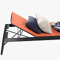 Modern Orange Cushioned Lounge Chair With Black Frame Pillows And Striped Blanket