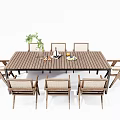 Outdoor Wooden Dining Table and Chairs Set With Woven Seats and Potted Plant