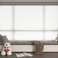 Cozy Bay Window Seat with Gray Pillows Teddy Bear Brown Blanket Open Book and Blinds