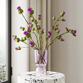 Transparent Pink Vase With Purple Flowers Placed On White Table Near Window Curtains