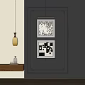 Black And White Landscape Paintings On Gray Wall With Wooden Shelf And Yellow Pendant Light