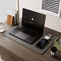 Black MacBook Laptop on Wooden Desk with Smartphone AirPods and Office Supplies