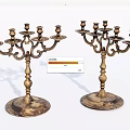 Two Vintage Brass Candelabra With Multiple Arms And Ornate Base Design