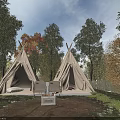 Scenic Garden Landscape With Gray Tent Autumn Colored Trees Teepees And Camping Chairs In Grassy Area