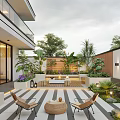 Modern Outdoor Garden With Wooden Deck Plants Outdoor Chairs Round Table And Decorative Lighting
