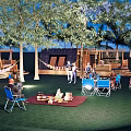 Scenic Camping Site With Trees Hammocks Picnic Area Folding Chairs And Tent For Relaxing