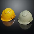 Yellow And Gray Safety Helmets On Black Background With Reflection