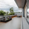 Modern Garden Terrace With Fire Pit Benches Lantern And Lush Green Plants