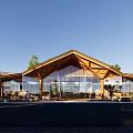 Modern Visitor Center With Wooden Gabled Roof And Glass Curtain Walls In Natural Surroundings