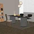 Modern Dark Wooden Dining Table And Chairs On Geometric Rug With Decorative Items