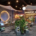JOHOBUS Bar Restaurant Interior With Lush Plants Circular Decoration Lighting And Pebble Floor
