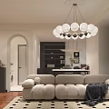 Modern Living and Dining Room with Beige Sofa Round Bulb Chandelier Black Beige Rug and Wooden Flooring