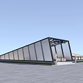 Modern Glass Facade Station With Sloped Roof And Entrance Sign In Plaza Area