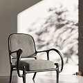 Modern Leisure Chair with Gray Cushion Black Armrests and Natural Light Tree Shadows
