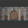 Ornate Historic Entrance Gate With Stone Brick Structure Intricate Carved Decorations And Arched Wooden Door