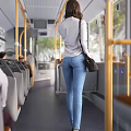 Woman Walking Through Bus Interior Wearing Light Gray Top Blue Jeans And Black Bag
