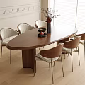 Wooden Oval Dining Table And Six Chairs Set With Vase Flowers In Light Room
