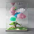 Colorful Art Installation With Hanging Clouds Butterflies Small Tree And Grass In Transparent Glass Container