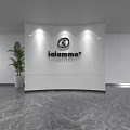 Modern Reception Desk With White Curved Backdrop Iaiammo Sign Green Plant And Marble Floor