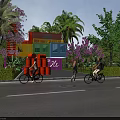 Colorful Container Building Surrounded by Palm Trees Purple Flowers and People Riding Bicycles