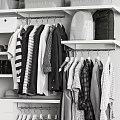 Organized Wardrobe With Gray And White Storage Boxes Various Shoes Hanging Garments And Drawers