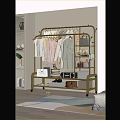 Gold Rolling Clothes Rack With Hanging Dresses Coats And Storage Bags Boxes