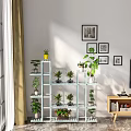 Bright Indoor Garden Decor With Multi Tiered Shelves Potted Plants And Wall Art