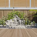 Rockery Stones Featuring Waterfall And Lush Plants On Wooden Deck With Bamboo Blinds Backdrop