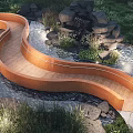 Curved Wooden Landscape Bridge With Flowing Water Rocks And Lush Green Grass