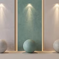 Three Sphere Sculptures In White Light Green And Light Gray Against Light Colored Walls With Green Panel And Illumination