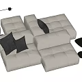 White Tufted Sectional Sofa With Dark Gray Cushions Black Floor Lamp And Side Table