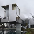 Modern Detached Villa With Cantilevered Structure Large Glass Windows And Water Feature Surrounding Trees