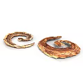 Two Brown Coiled Snakes Showing Curled Body Forms Against White Backdrop