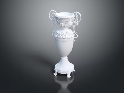 White Decorative Vase With Ornate Handles And Carved Floral Details On Pedestal Base 3d model