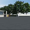 Modern Entrance Gate With White Walls Security Booth Trees And Asphalt Pavement Under Blue Sky