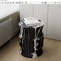 Black And White Marble Side Table With Cylindrical Design And Books On Wooden Floor