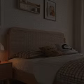 Wooden Double Bed With Woven Headboard Pillows Blanket Nightstand Table Lamp Window Blinds And Wall Art