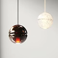 Hanging Spherical Pendant Lights With Metallic Glossy And White Textured Designs On Light Background
