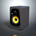 Stylish Black Audio Speaker With Yellow Circular Woofer And Modern Sleek Design