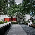 Garden Landscape With Lush Trees Green Plants Stone Path Red Wall And Bench