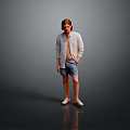 Man In Light Cardigan And Shorts Standing Against Gray Background With Floor Reflection