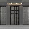 Beige Curved Decorative Door Handles Mounted On Dark Door With Gray Wall Background