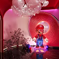 Fantasy Bar Interior with Purple Lighting Circular Decor Large Floral Sculpture and Reflective Floor